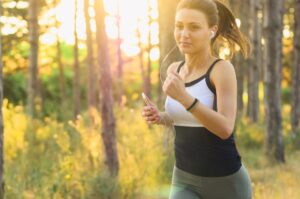 Woman jogging to help boost her positive mindset